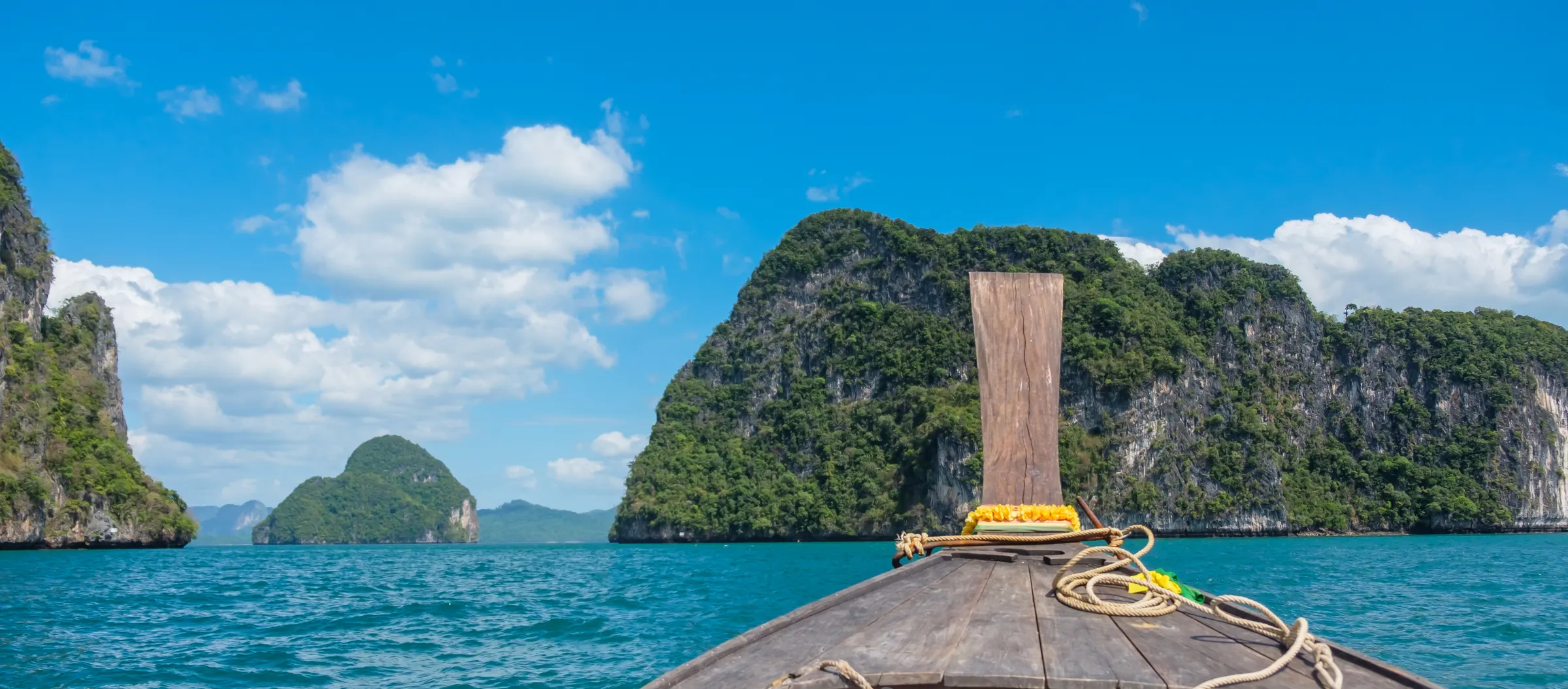 Longtail boat among limestone islands in Krabi, Thailand
